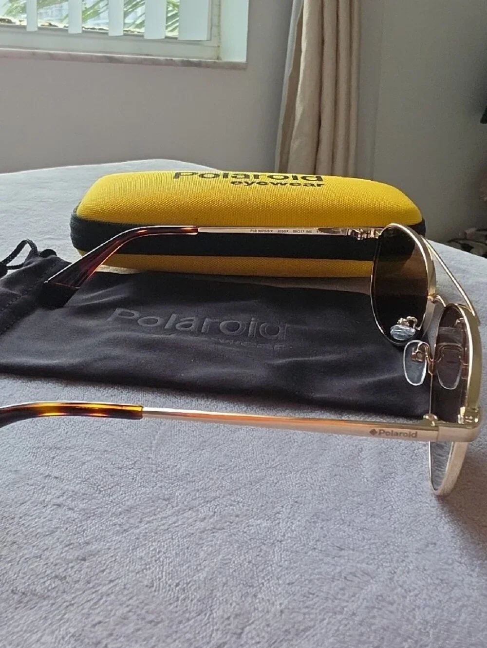 Polaroid Gold Frame Sunglasses with Yellow Case